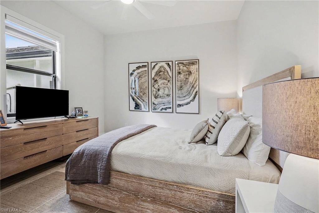 1720 21st Street Southwest Naples, FL 34117 - Photo 23 of 42 Bedroom featuring a ceiling fan