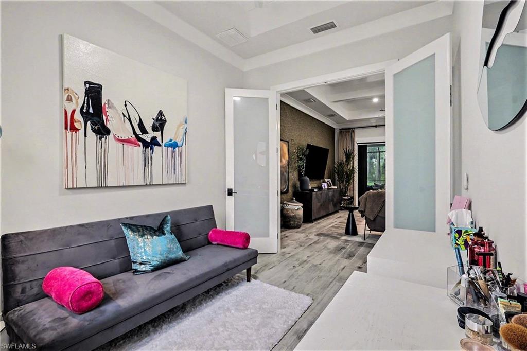 1720 21st Street Southwest Naples, FL 34117 - Photo 28 of 42 Living area with light wood-style floors