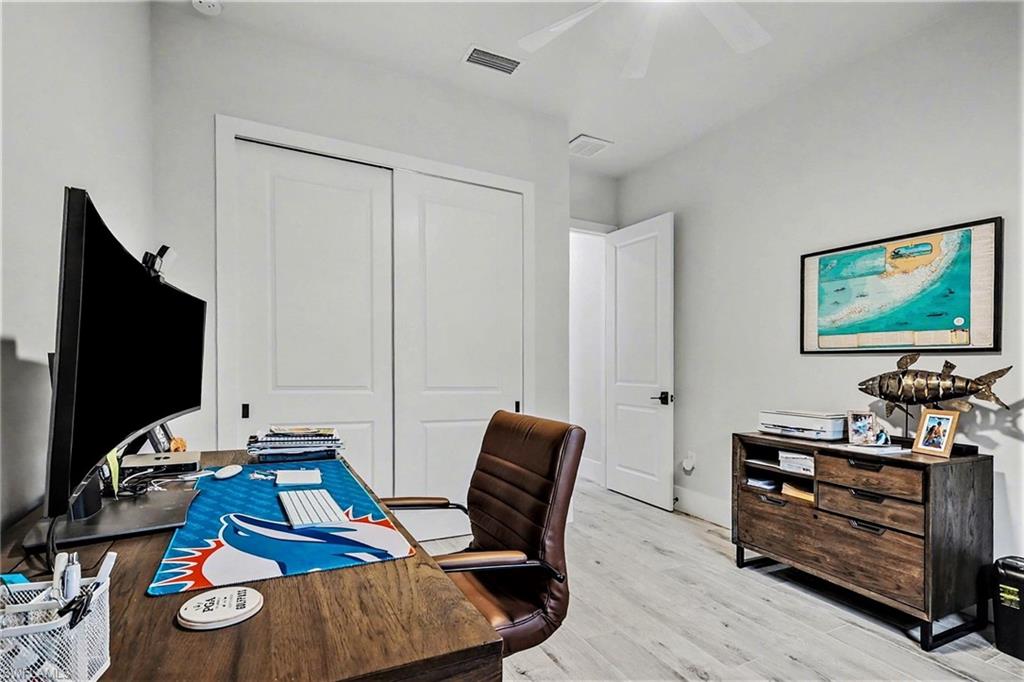 1720 21st Street Southwest Naples, FL 34117 - Photo 30 of 42 Home office with light wood-type flooring and ceiling fan