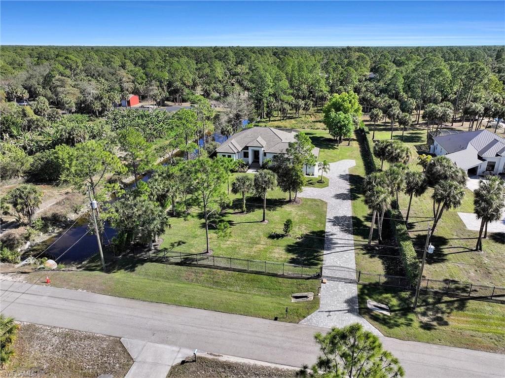 1720 21st Street Southwest Naples, FL 34117 - Photo 41 of 42 Aerial view of a heavily wooded area