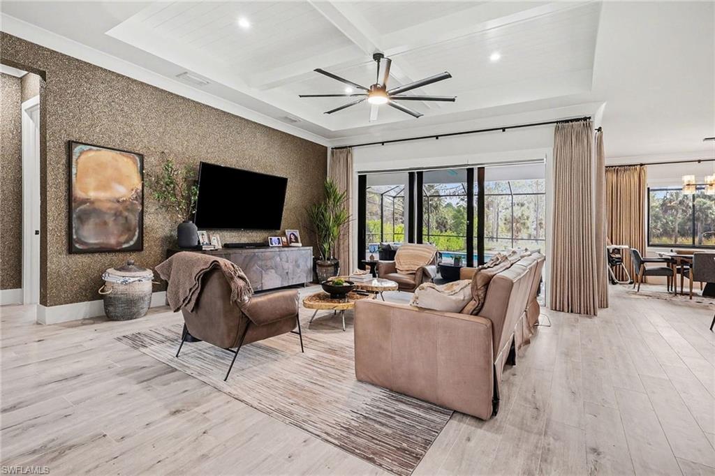 1720 21st Street Southwest Naples, FL 34117 - Photo 5 of 42 Living area featuring recessed lighting, coffered ceiling, beamed ceiling, light wood-type flooring, and healthy amount of natural light