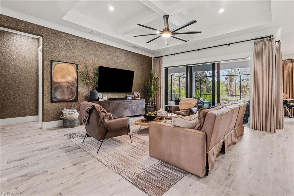 1720 21st Street Southwest Naples, FL 34117 - Photo 7 of 42 Living area with recessed lighting, light wood-style flooring, coffered ceiling, beam ceiling, and ceiling fan