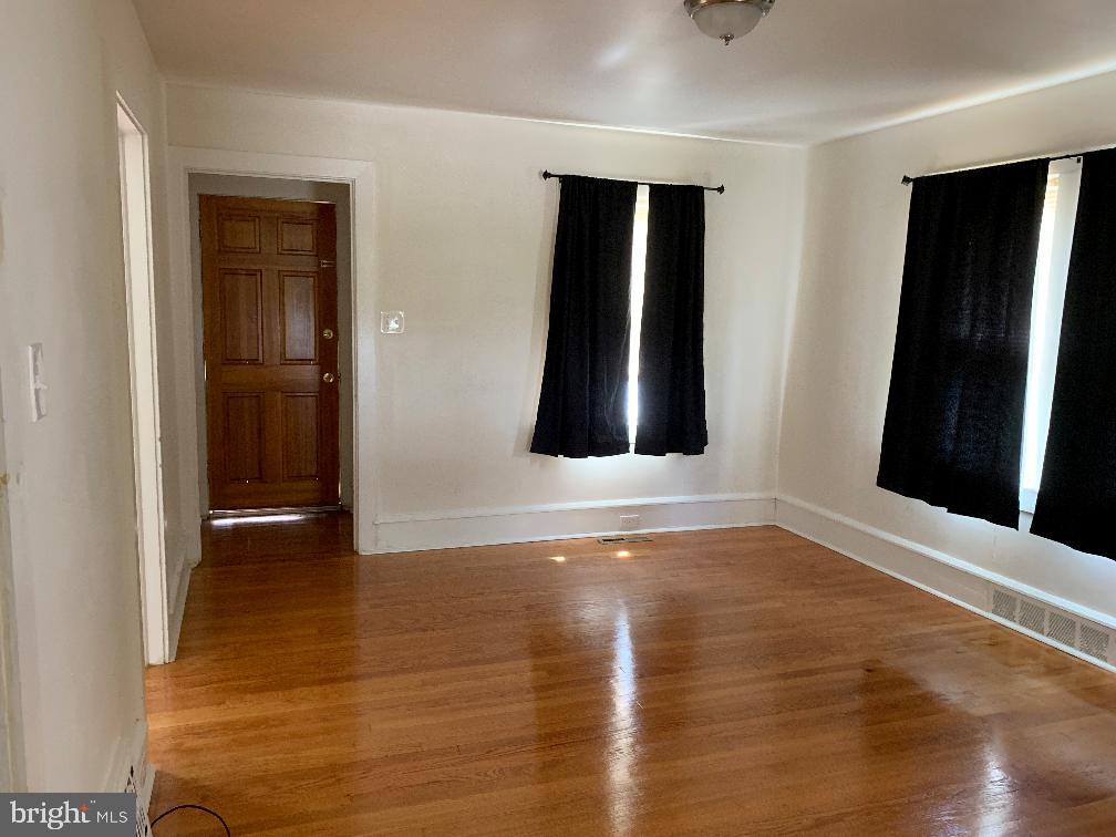 223 Dickinson Road Glassboro, NJ 08028 - Photo 5 of 10 wooden floor in an empty room