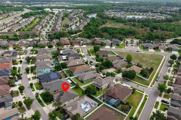 an aerial view of a houses with outdoor space
