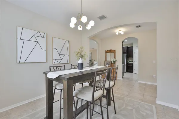 a kitchen with stainless steel appliances granite countertop a refrigerator stove and microwave