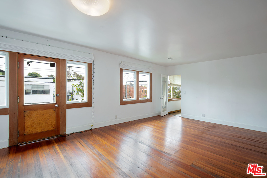 805 Hampton Drive Venice, CA 90291 - Photo 24 of 27 a view of an empty room with wooden floor and a window