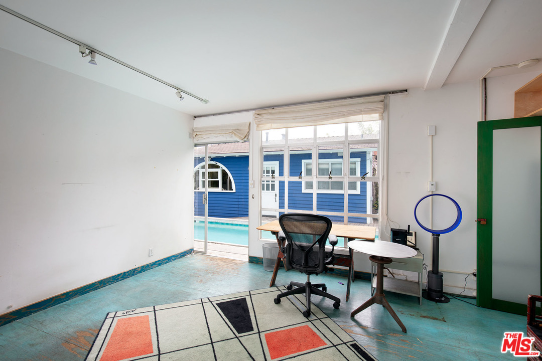 805 Hampton Drive Venice, CA 90291 - Photo 7 of 27 a workspace with furniture hardwood and a window