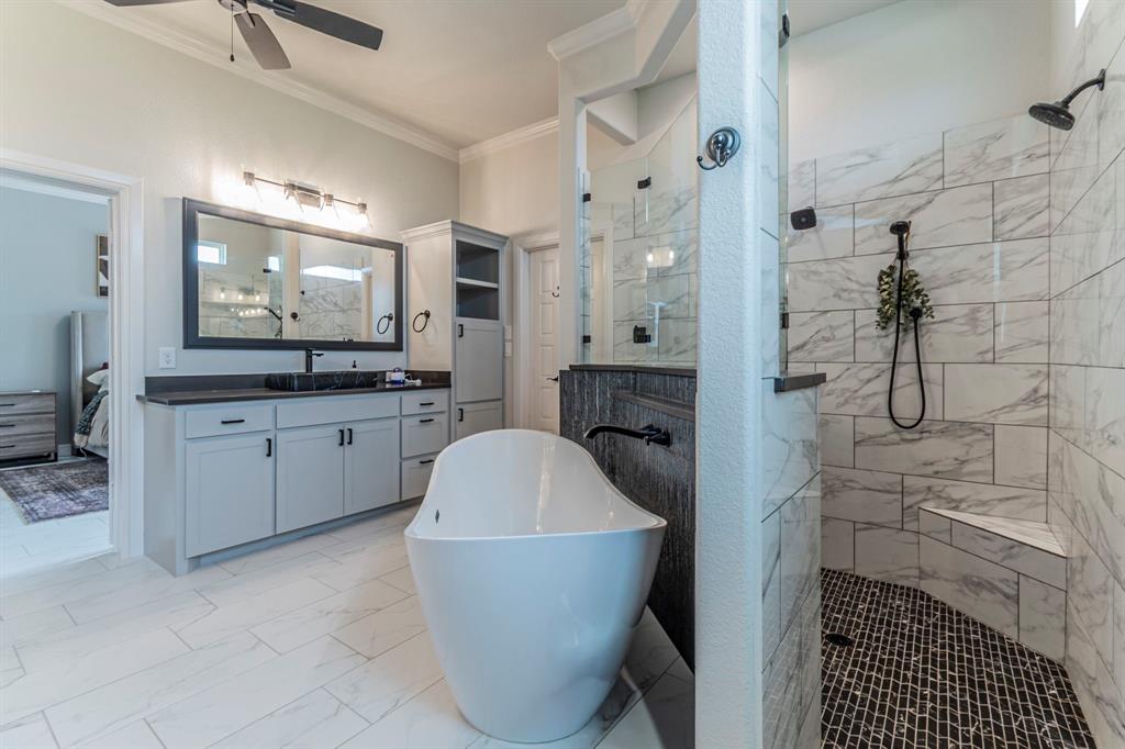 150 Las Brisas Drive Decatur, TX 76234 - Photo 15 of 33 Ensuite bathroom with crown molding, a marble finish shower, vanity, a soaking tub, and a ceiling fan