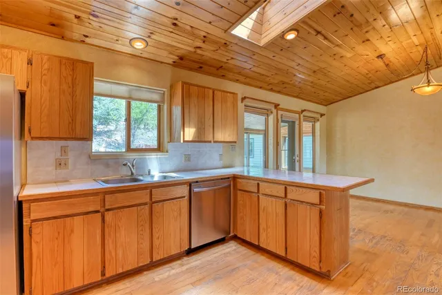 a kitchen with sink and window