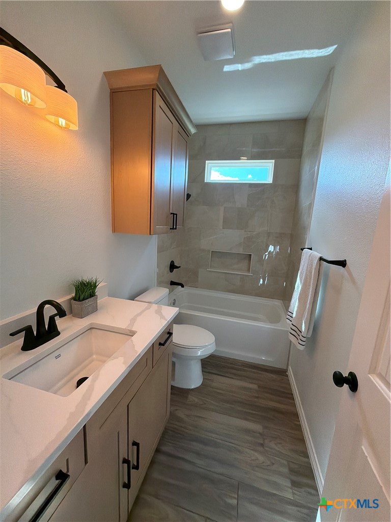 15006 Armstrong Ests Road Salado, TX 76571 - Photo 11 of 29 a bathroom with a double vanity sink toilet and shower