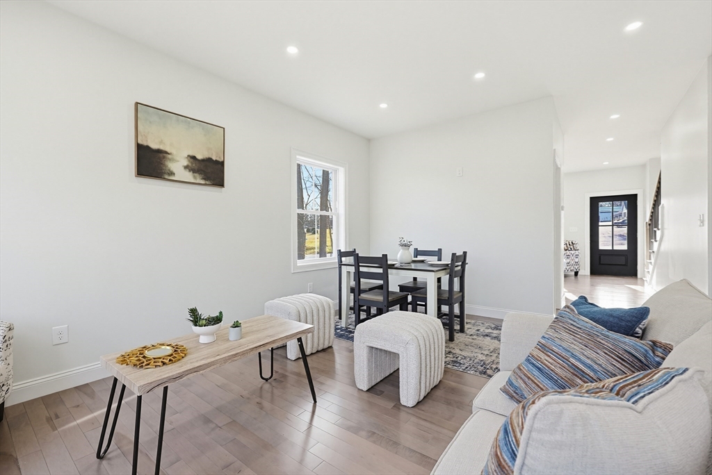 673 Pleasant Street Leicester, MA 01542 - Photo 18 of 38 a living room with furniture and wooden floor