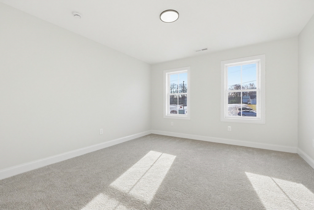 673 Pleasant Street Leicester, MA 01542 - Photo 26 of 38 an empty room with windows