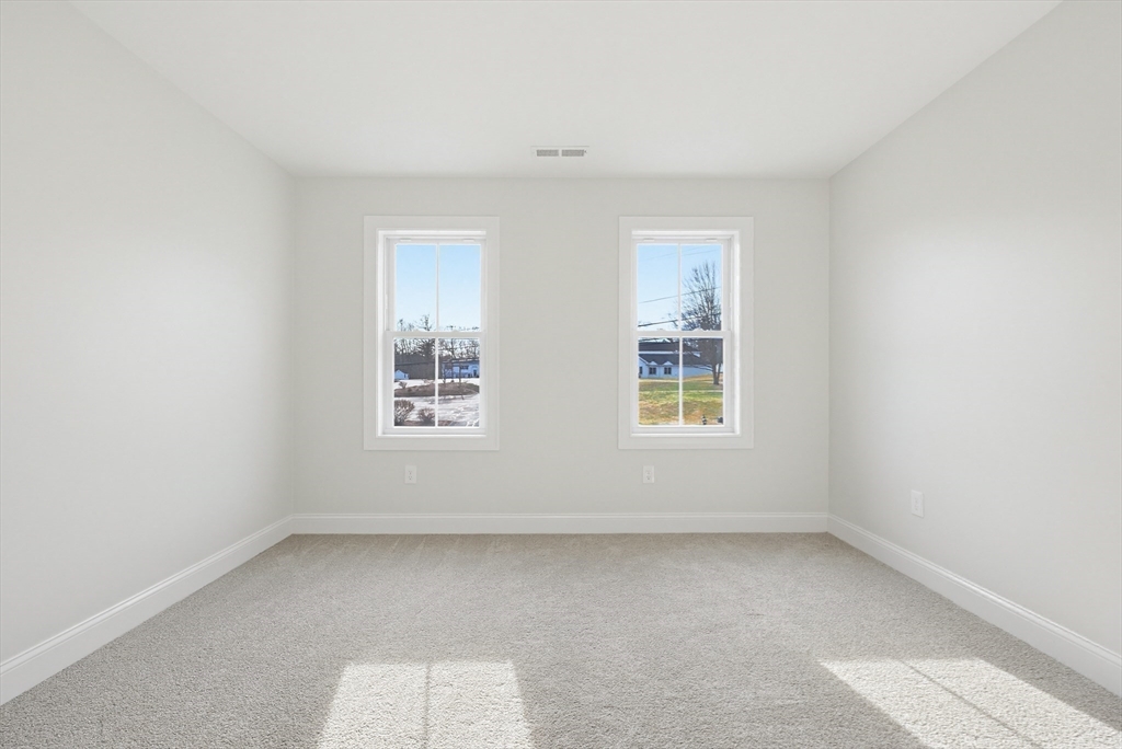 673 Pleasant Street Leicester, MA 01542 - Photo 28 of 38 an empty room with a window