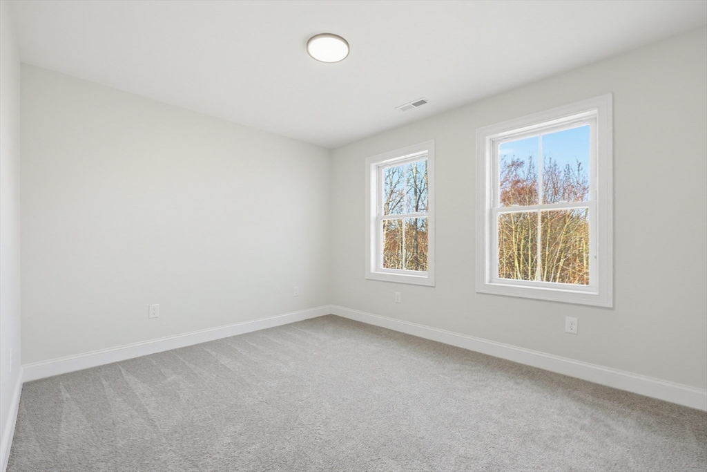 673 Pleasant Street Leicester, MA 01542 - Photo 29 of 38 an empty room with windows