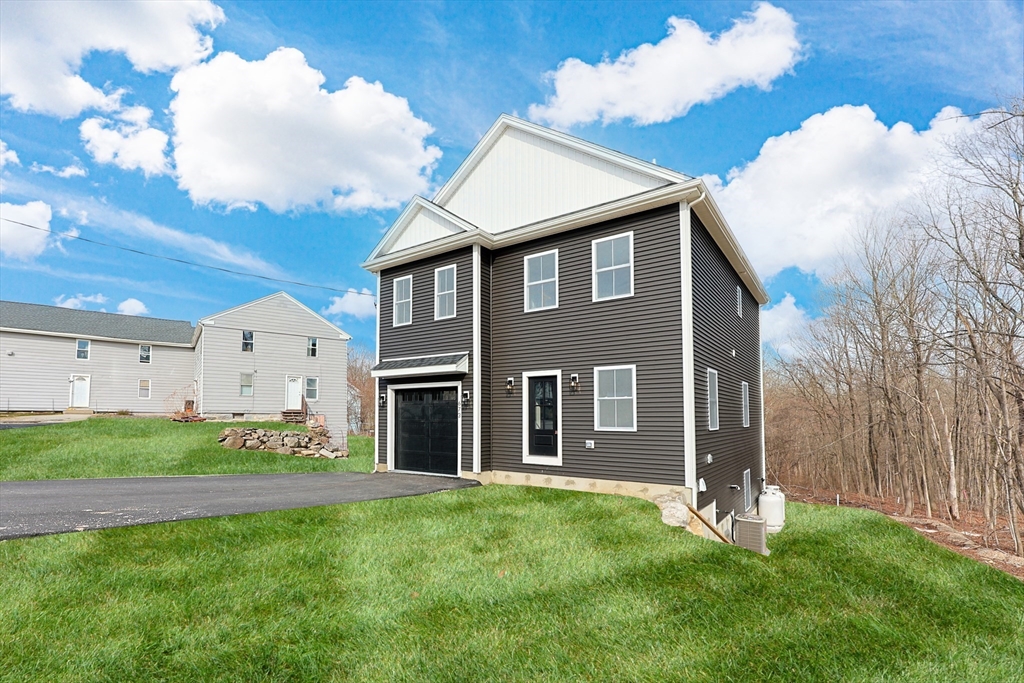 673 Pleasant Street Leicester, MA 01542 - Photo 3 of 38 a view of a house with a yard