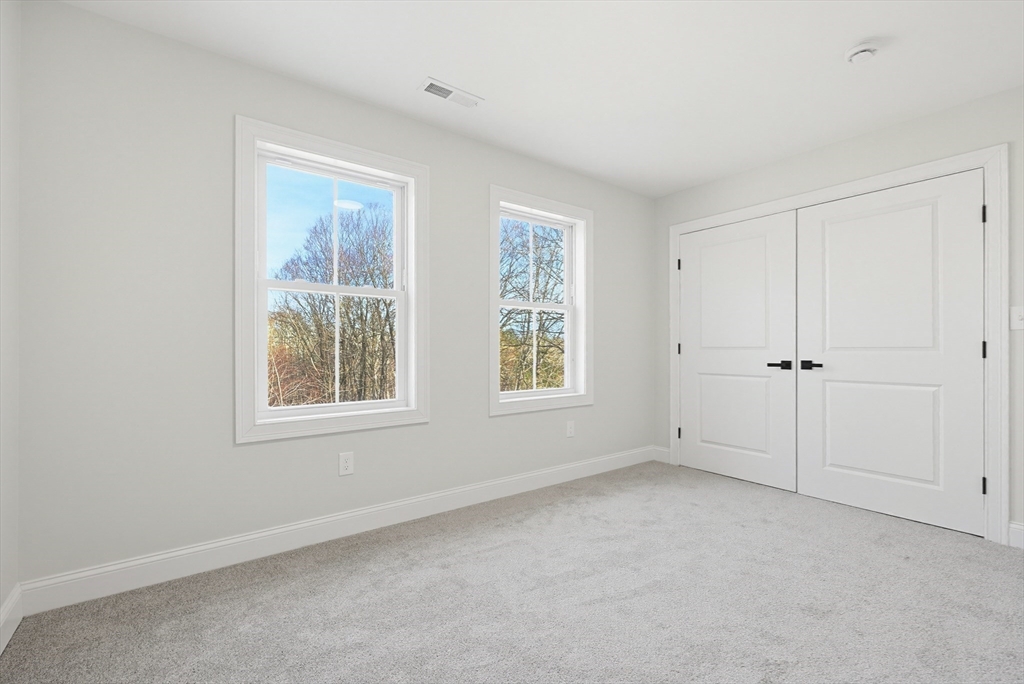 673 Pleasant Street Leicester, MA 01542 - Photo 31 of 38 an empty room with windows