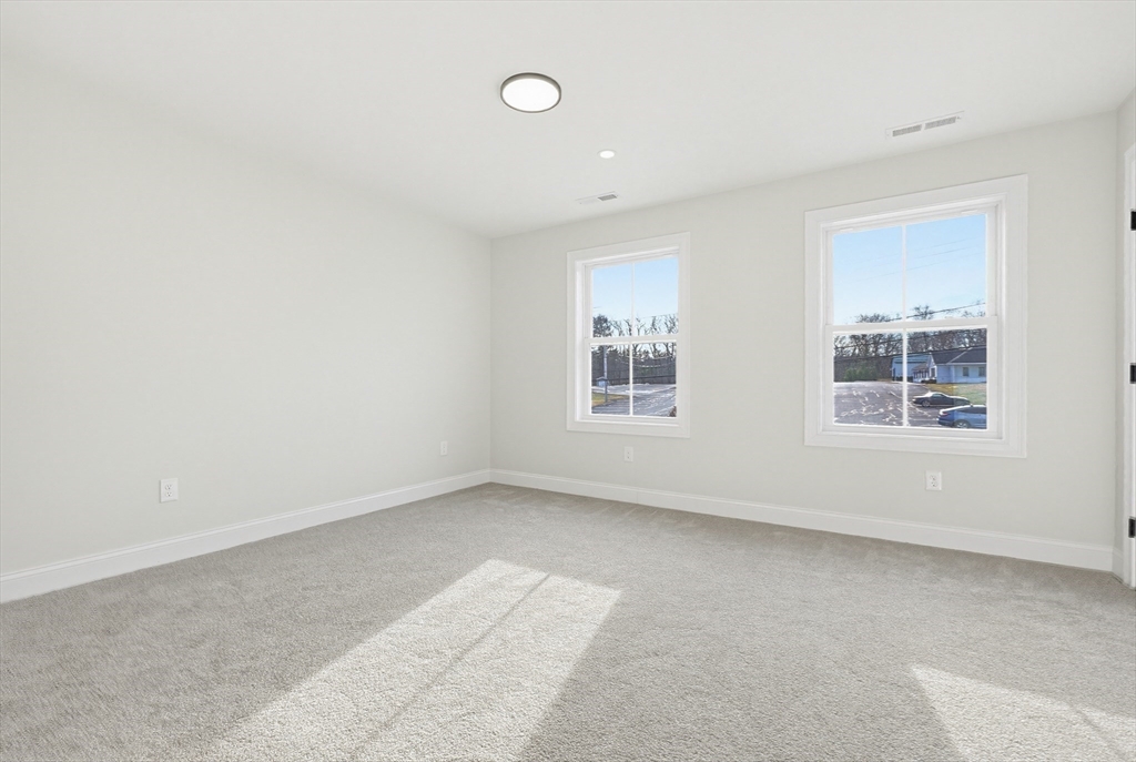 673 Pleasant Street Leicester, MA 01542 - Photo 32 of 38 an empty room with windows