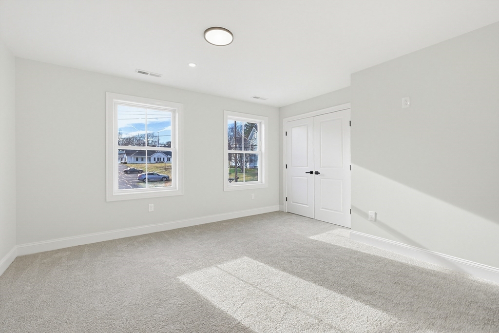 673 Pleasant Street Leicester, MA 01542 - Photo 33 of 38 an empty room with windows