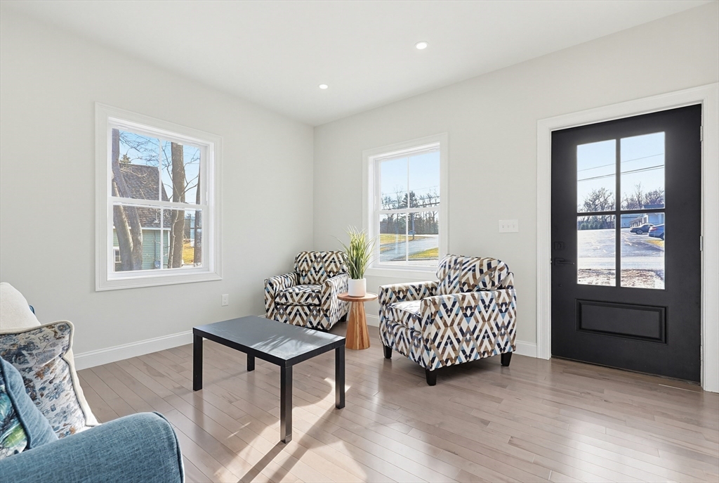 673 Pleasant Street Leicester, MA 01542 - Photo 5 of 38 a living room with furniture and windows