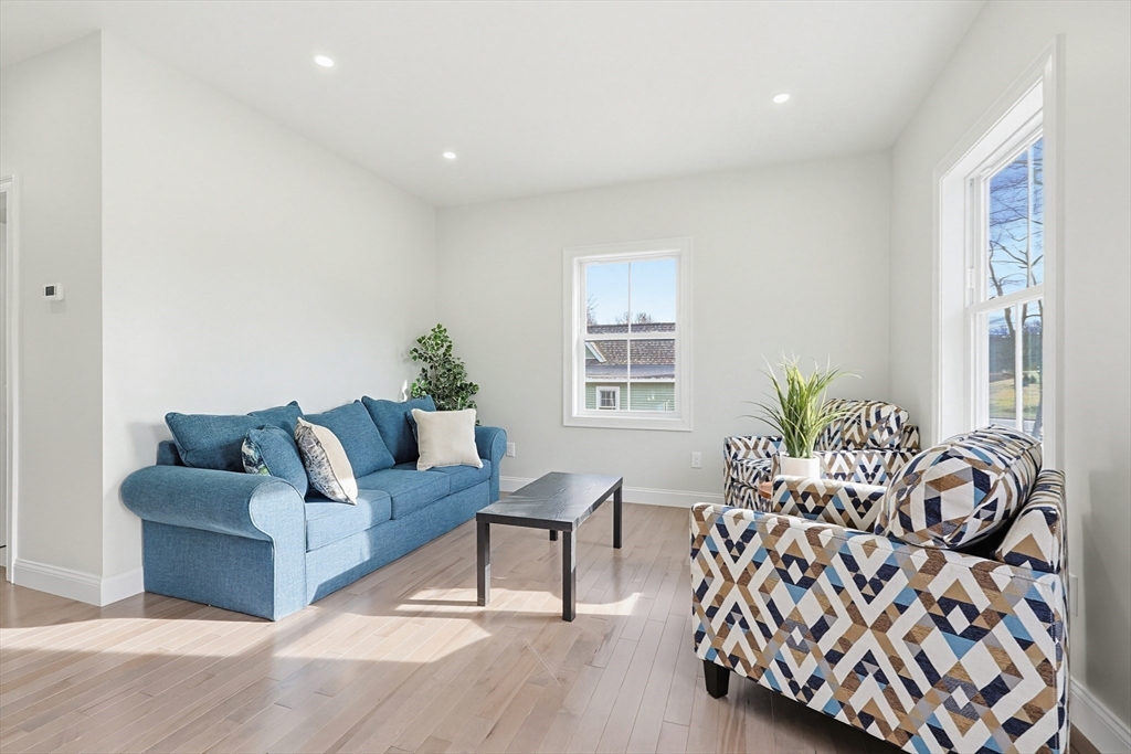 673 Pleasant Street Leicester, MA 01542 - Photo 6 of 38 a living room with furniture and windows
