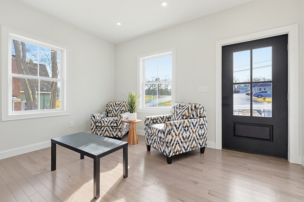 673 Pleasant Street Leicester, MA 01542 - Photo 7 of 38 a living room with furniture and windows