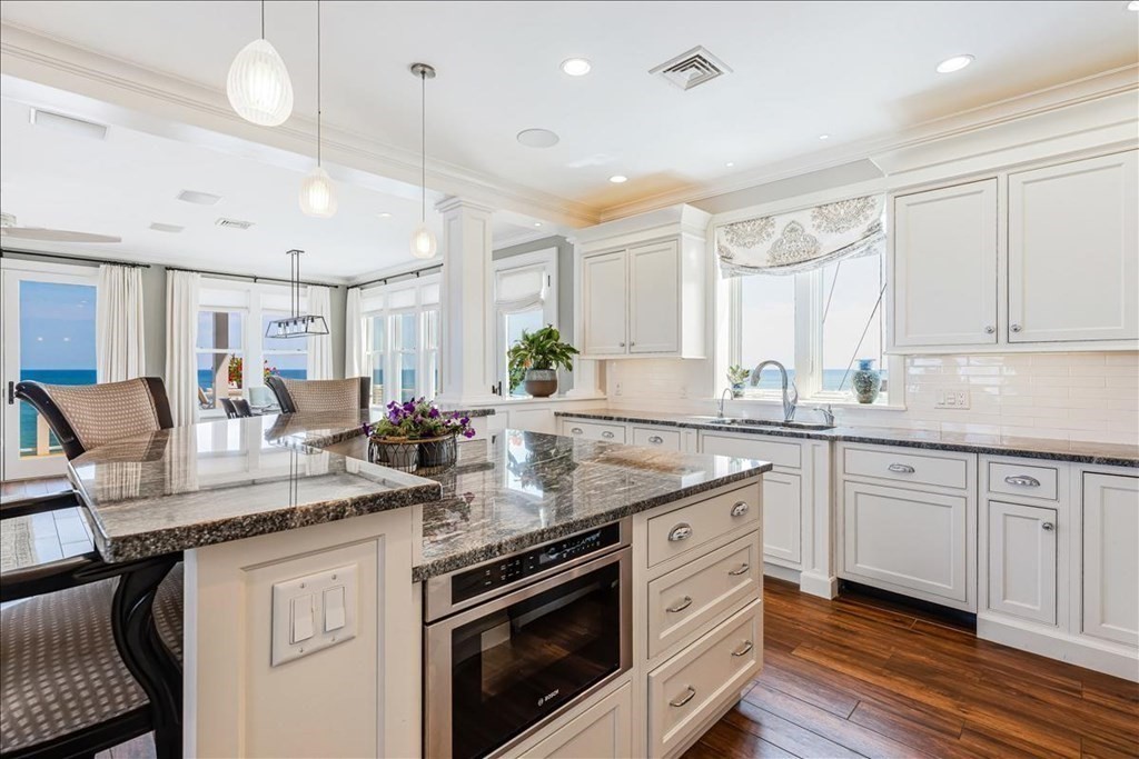 12 Monitor Road Marshfield, MA 02050 - Photo 11 of 42 a kitchen with stainless steel appliances granite countertop a sink window and cabinets