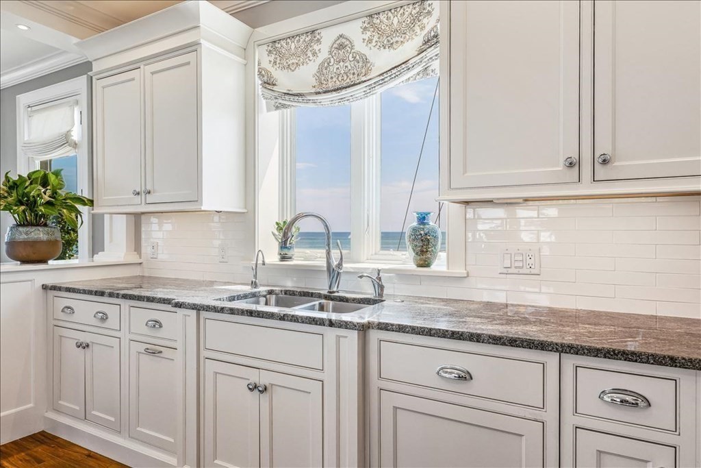 12 Monitor Road Marshfield, MA 02050 - Photo 12 of 42 a kitchen with granite countertop white cabinets and a window