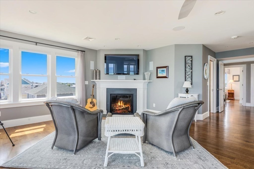 12 Monitor Road Marshfield, MA 02050 - Photo 23 of 42 a living room with furniture and a fireplace