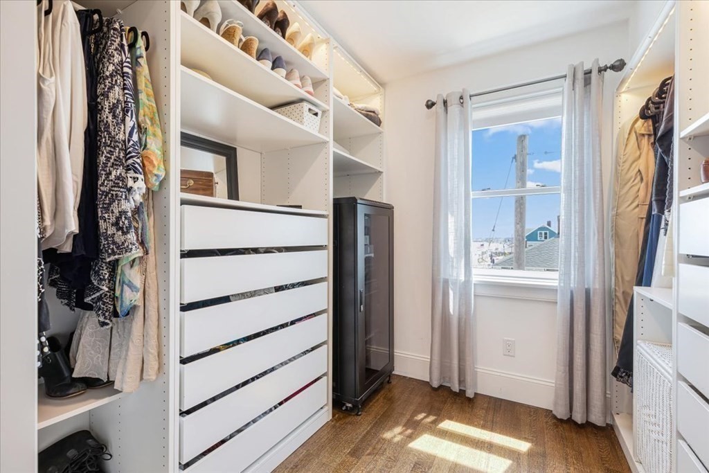 12 Monitor Road Marshfield, MA 02050 - Photo 25 of 42 a view of walk in closet with clothes and shoes
