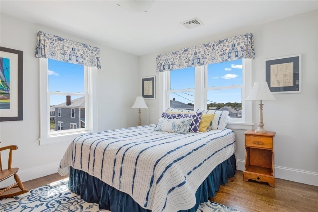 12 Monitor Road Marshfield, MA 02050 - Photo 27 of 42 a bedroom with a bed and a table in it