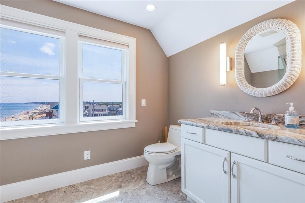 12 Monitor Road Marshfield, MA 02050 - Photo 30 of 42 a bathroom with a toilet a sink and mirror