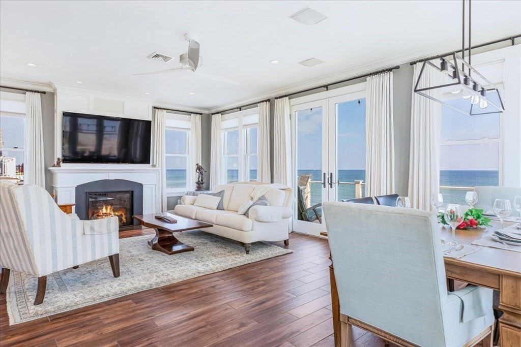 12 Monitor Road Marshfield, MA 02050 - Photo 5 of 42 a living room with fireplace furniture and a flat screen tv