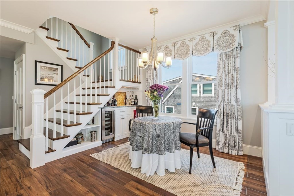 12 Monitor Road Marshfield, MA 02050 - Photo 9 of 42 a view of entryway dining room and hall with wooden floor