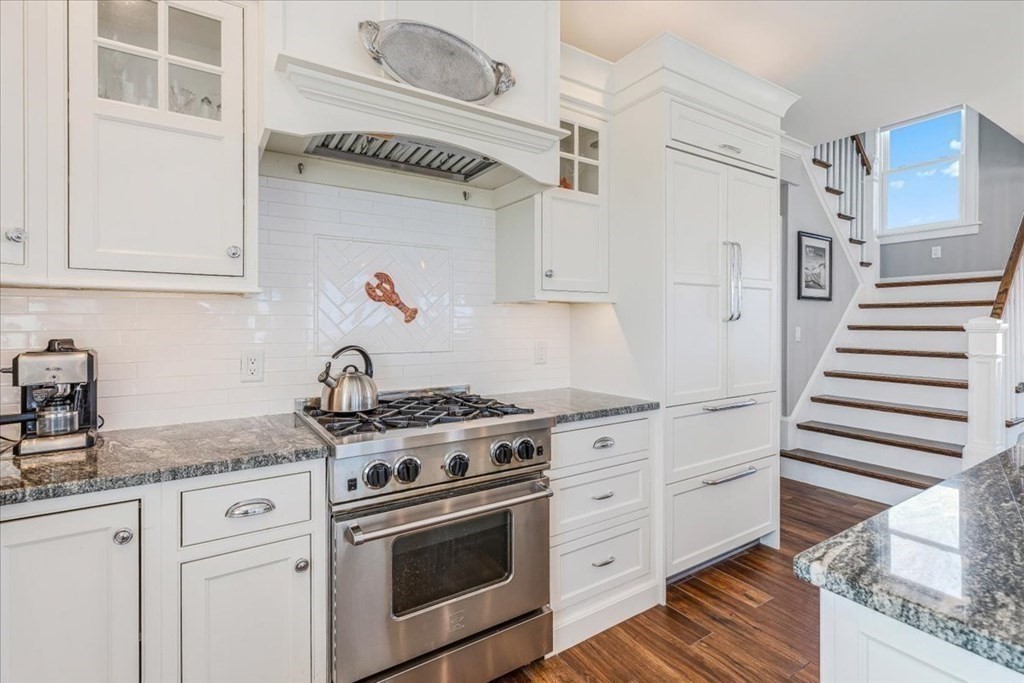 12 Monitor Road Marshfield, MA 02050 - Photo 10 of 42 a kitchen with granite countertop white cabinets and white appliances