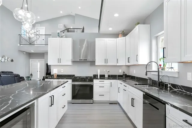 a kitchen with a sink stove and cabinets