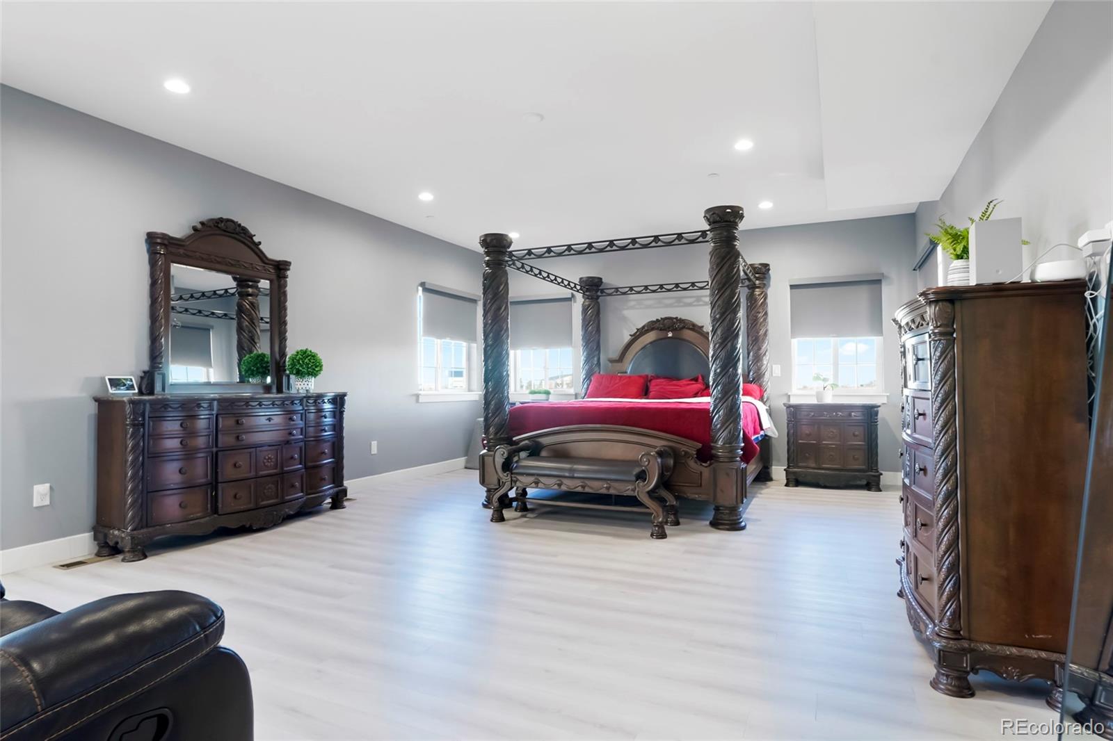 3161 Xmore Road Byers, CO 80103 - Photo 15 of 46 a bedroom with a bed and a car