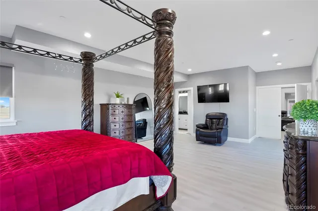 a bed room with a bed and a flat screen tv