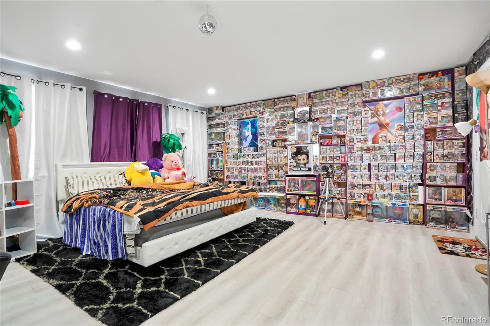 3161 Xmore Road Byers, CO 80103 - Photo 19 of 46 a bed room with a bed and a book shelf