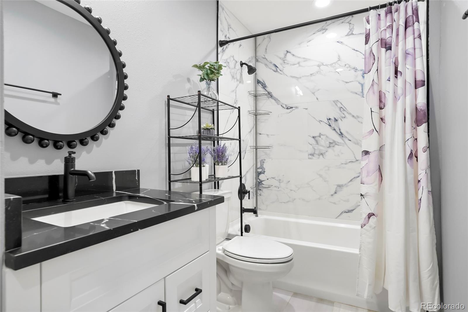 3161 Xmore Road Byers, CO 80103 - Photo 23 of 46 a bathroom with a sink a toilet and shower