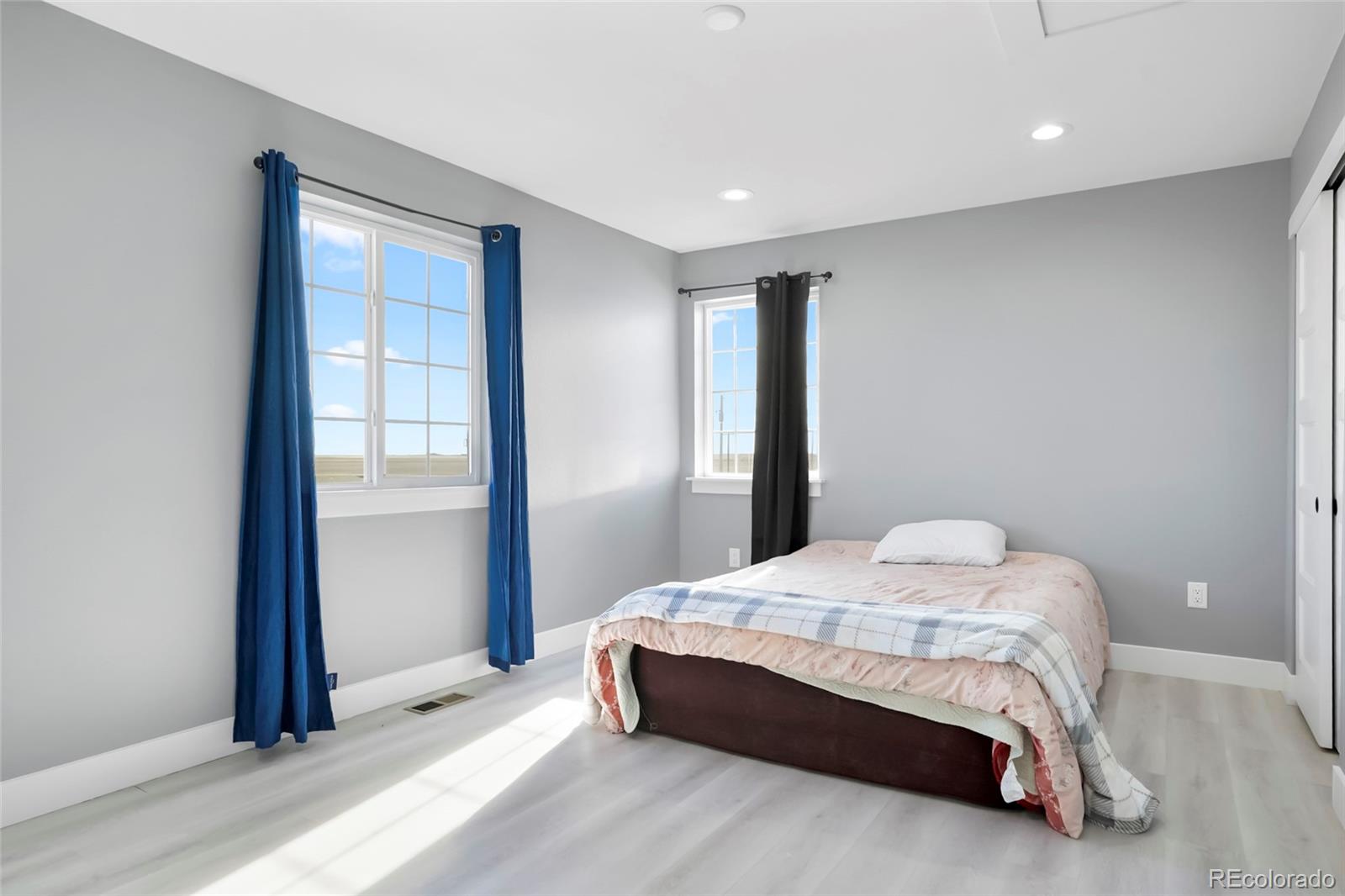 3161 Xmore Road Byers, CO 80103 - Photo 24 of 46 a bedroom with a bed and a window