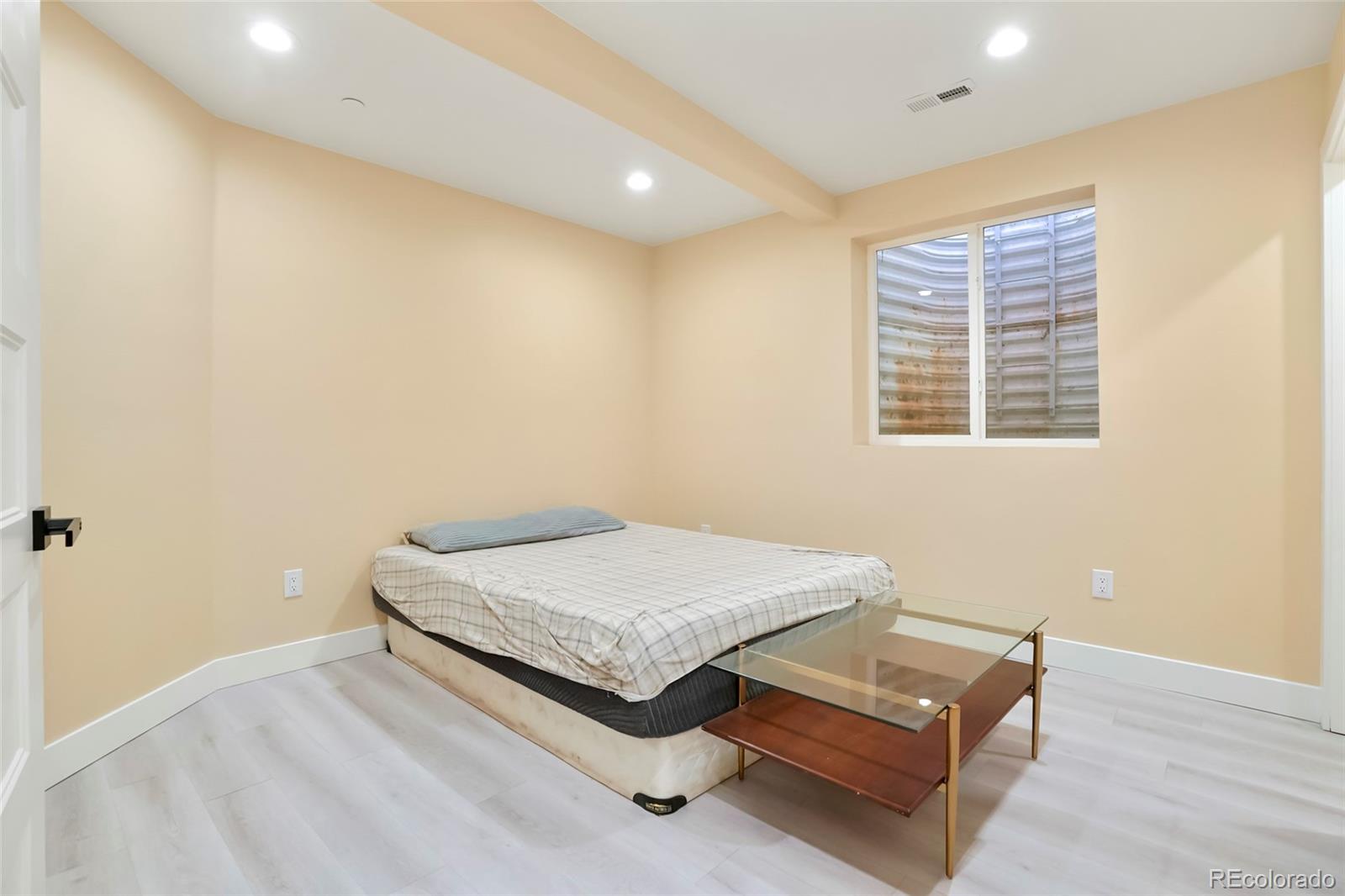 3161 Xmore Road Byers, CO 80103 - Photo 27 of 46 a room with a bed and a window