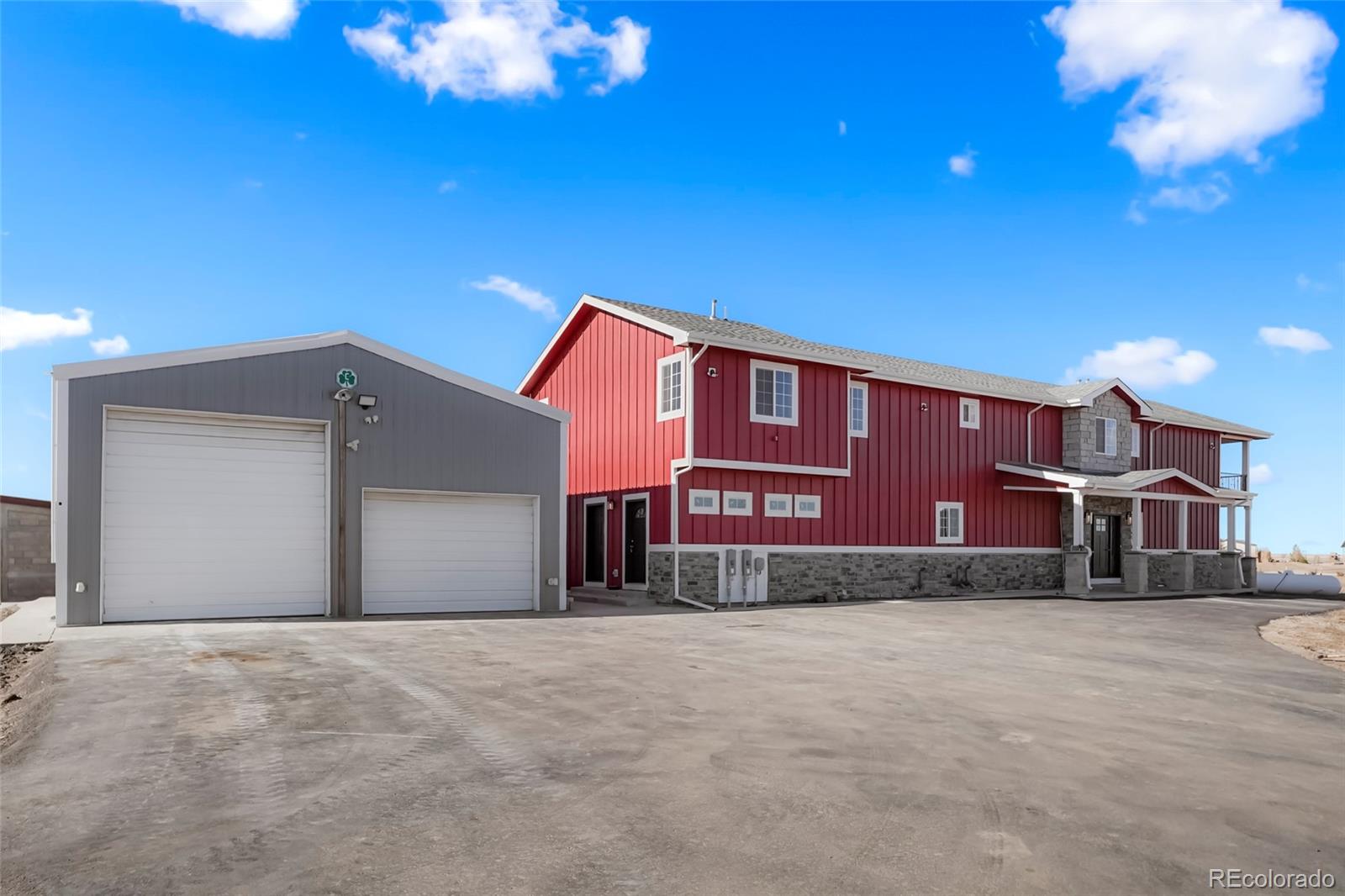 3161 Xmore Road Byers, CO 80103 - Photo 34 of 46 a front view of a house with a yard