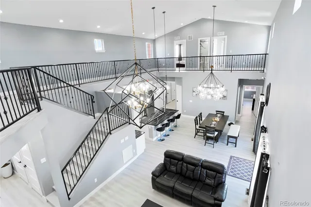 a view of a livingroom with furniture and hardwood floor
