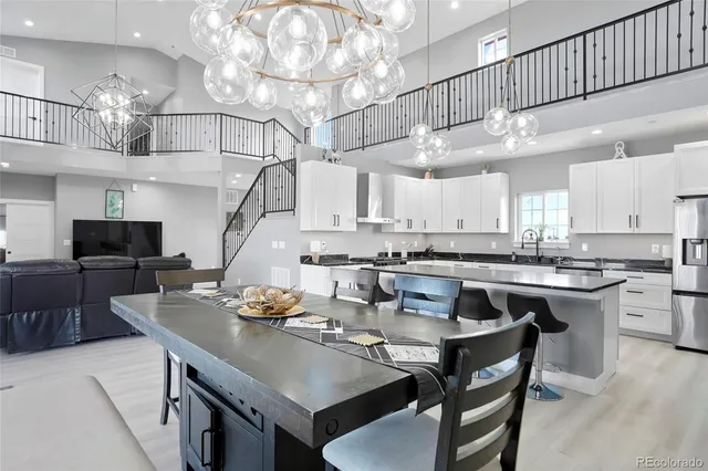 a kitchen with a dining table and chairs