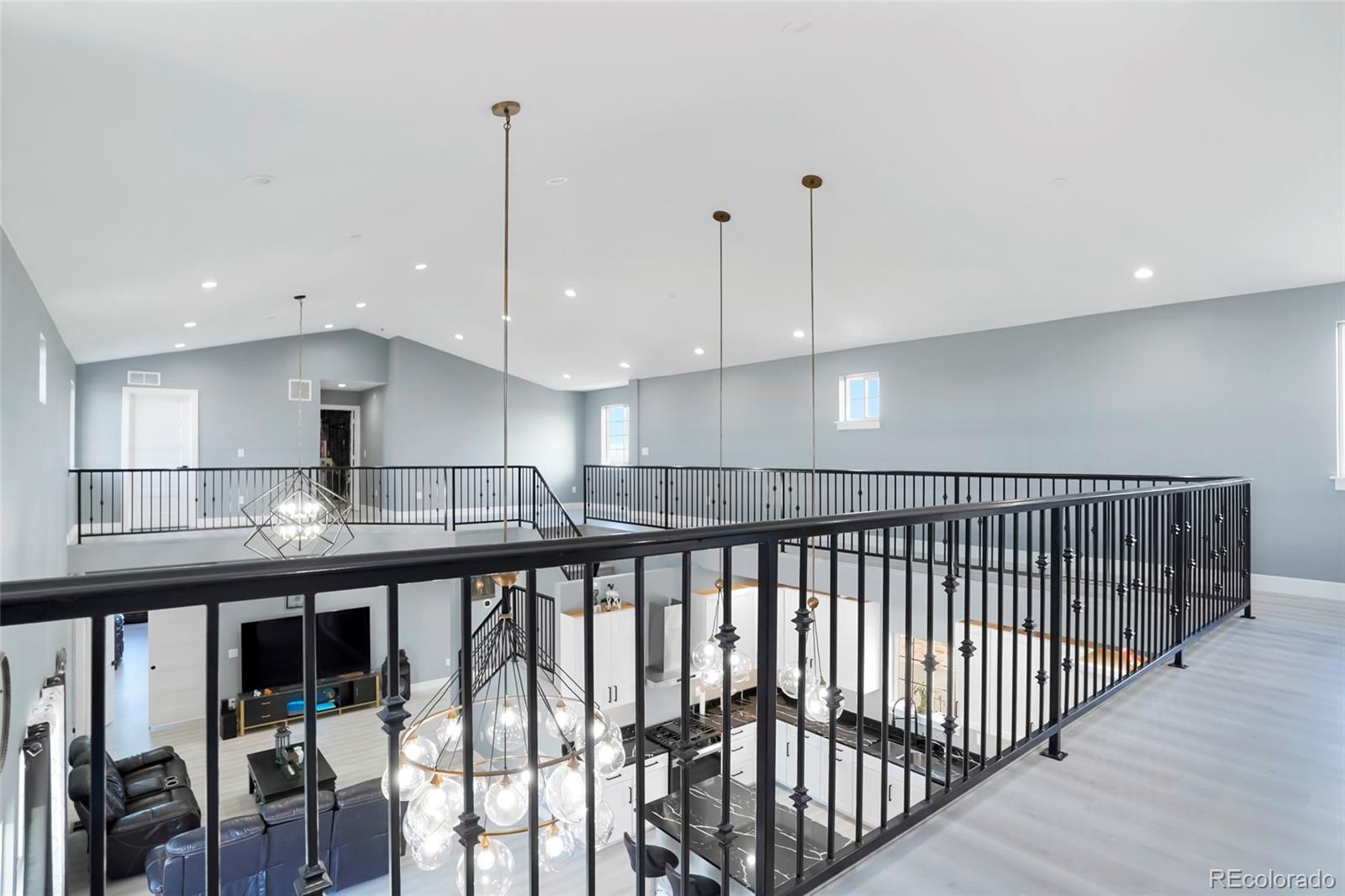 3161 Xmore Road Byers, CO 80103 - Photo 7 of 46 a view of a kitchen with stainless steel appliances granite countertop a stove top oven a sink with wooden floors