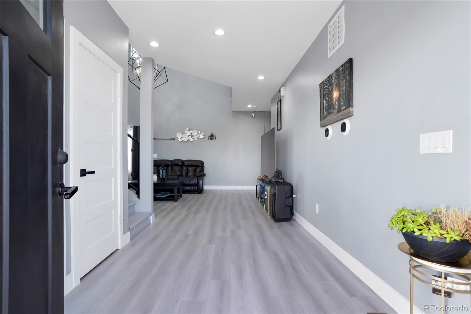 3161 Xmore Road Byers, CO 80103 - Photo 8 of 46 a kitchen with furniture and a potted plant