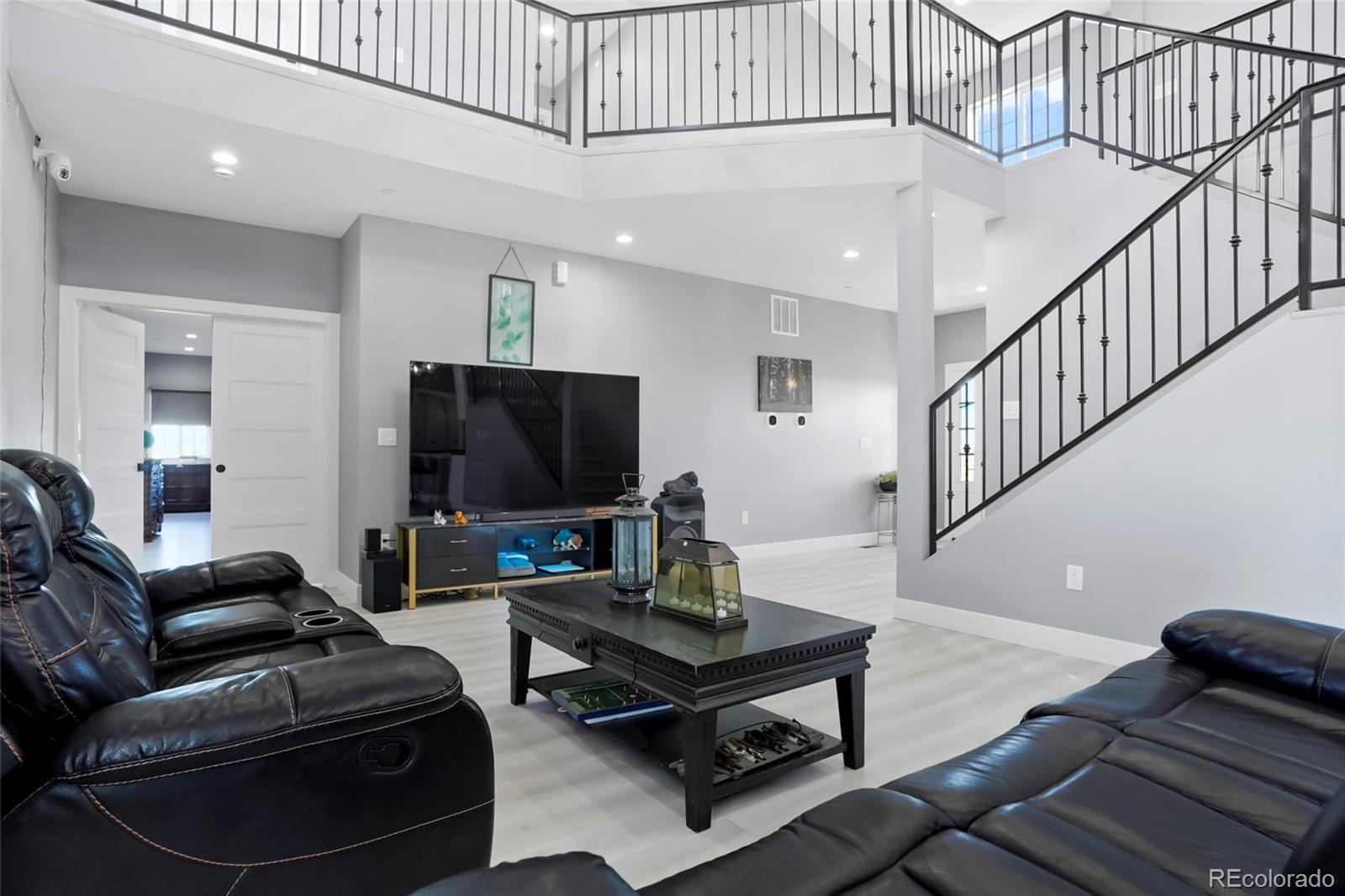 3161 Xmore Road Byers, CO 80103 - Photo 9 of 46 a living room with furniture and a flat screen tv