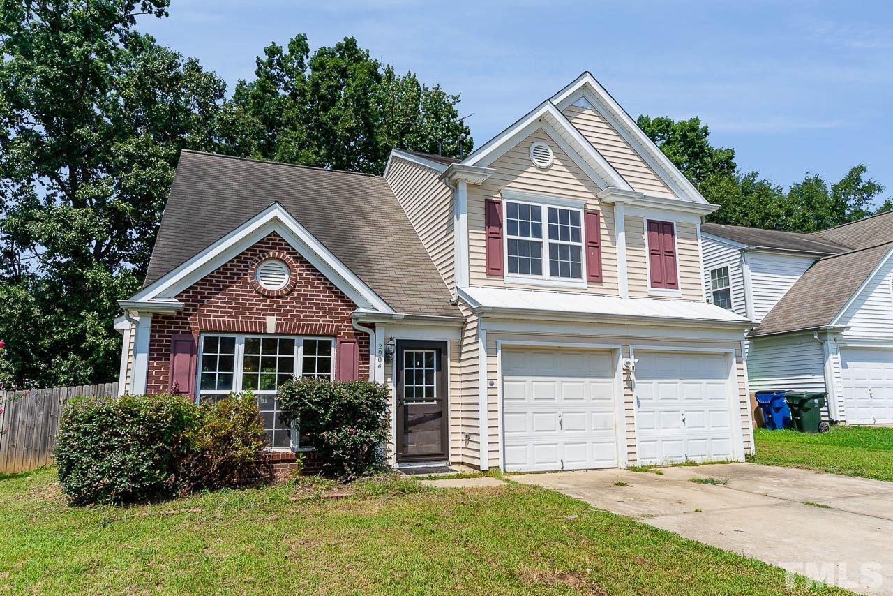 2904 Hayling Drive Raleigh, NC 27610 - Photo 3 of 24 a front view of a house with a yard