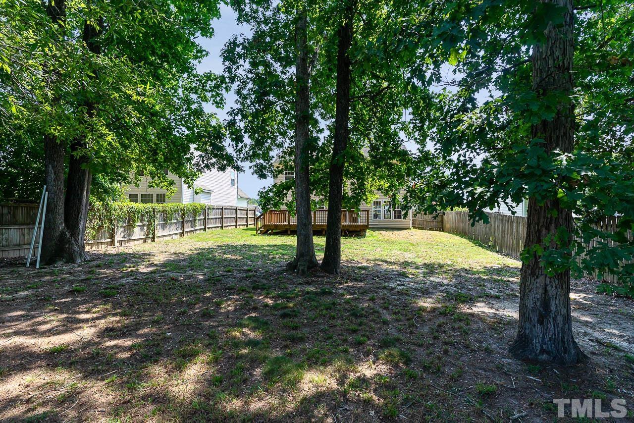 2904 Hayling Drive Raleigh, NC 27610 - Photo 8 of 24 a view of a field with trees in the background