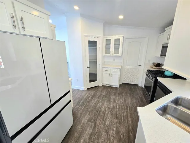 a view of living room with furniture and wooden floor
